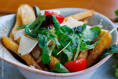 French fries with salad and cheese