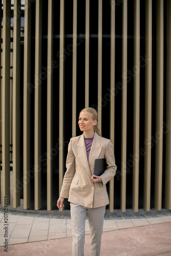 Businesswoman walks confide...
