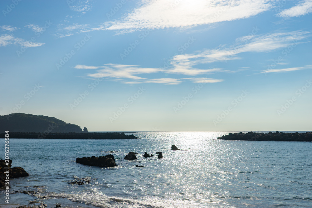 Obraz premium Sparkling Sea and Coastal Scenery at Shirahama Beach in Nagasaki, Japan