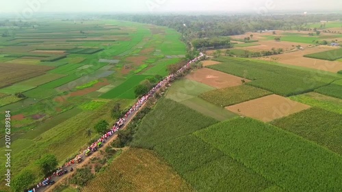 Pilgrims moving through farmers' fields in Mayapur. Drone footage taken at an altitude of approximately 60 meters.