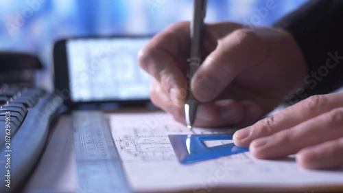 Corporate Engineer Reviewing Architectural Blueprints In Modern Office