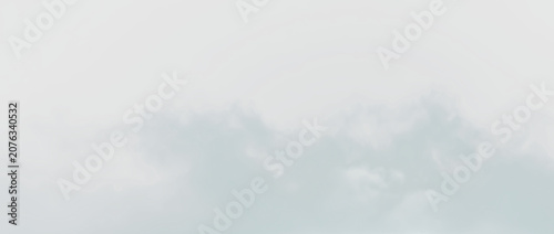 Quadro su tela White clouds float softly against a transparent background during daytime in the