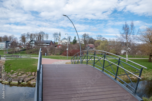 Curved footbridge in a quiet village park
