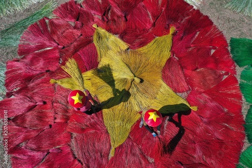 Drying sedge to make handmade mats.