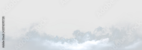 Slika na platnu Clouds floating in the sky on a clear day with light appearing from below, on a