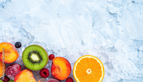 Assorted frozen fruits on crushed ice with clean background 3