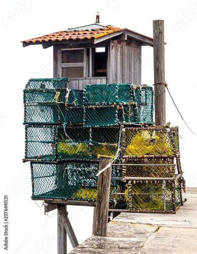 Traditional wooden house with green metal roof in village.