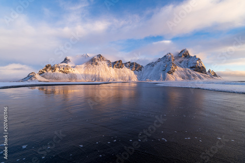Vestrahorn mountain at sunrise above black sand beach, Iceland