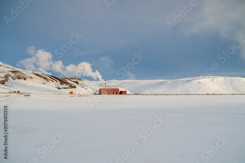 Geothermal power station in snowy Icelandic winter landscape near Krafla