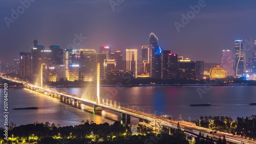 High angle timelapse of the Qianjiang Third Bridge and Qianjiang New District in Hangzhou, Zhejiang Province, China