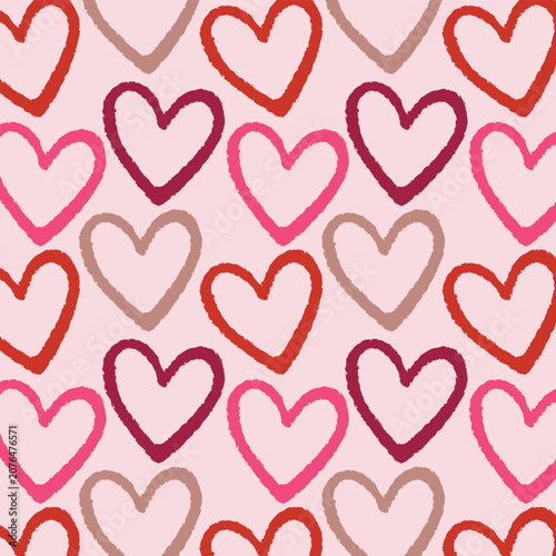 Seamless pattern with hand drawn red and pink hearts on a pink background. Cute romantic heart outline seamless pattern for Valentine's Day