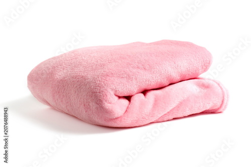 There is a folded blanket lying on a white background.