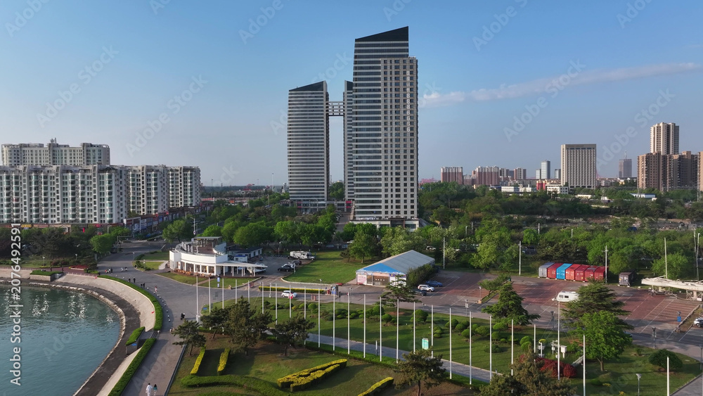 Obraz premium Modern urban architecture complex along the coastal area of Rizhao Shandong under clear morning sky