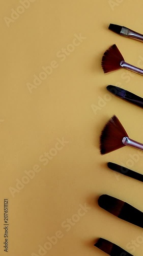 Appearance of Paintbrushes on a Yellow Background – School Yellow Background