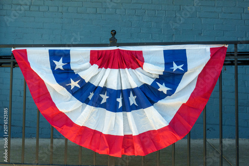 Bunting decoration displayed on a fence during a festive event