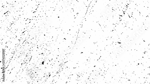 Distress overlay texture with scattered black specks on a white background creating a grunge effect abrasion aged