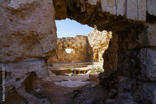 Ruins of the ancient city of Salamis in Cyprus, showcasing weathered stone structures and classical columns. These remnants reflect the architectural and cultural legacy of an ancient civilization.