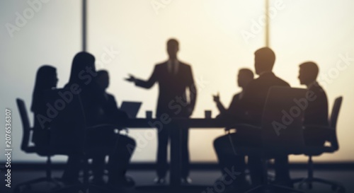 Business meeting with a presenter addressing a group of colleagues