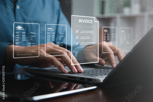 Business professional managing digital invoices, billing documents and financial records on laptop with virtual accounting interface for payment verification, compliance and reporting.