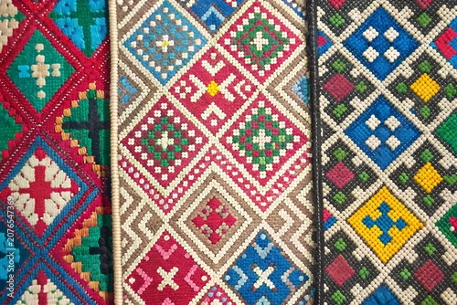 Fotografie Colorful traditional ethnic embroidery fabric texture pattern