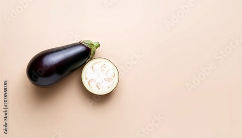 Fresh Eggplant on Warm Beige Background