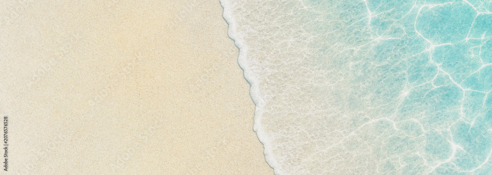 Naklejka premium Sandy beach and turquoise water aerial view with foamy wave edge sand ocean sea coast