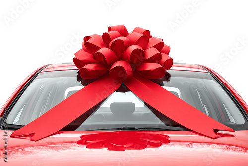 Red Car with Large Gift Bow Isolated on White Background Concept of New Car Purchase and Surprise Gift