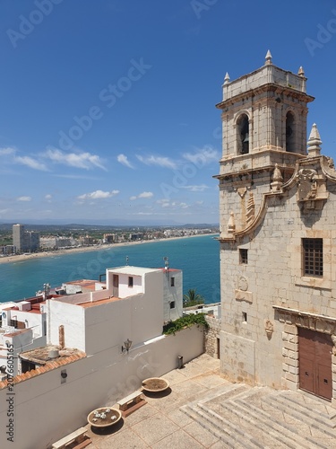 Church of Virgen de los Ermitanos bell tower and sea view in Peniscola, Spain