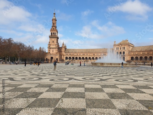 Patterned tiled pavement and fountain at Plaza de Espana in Seville, Spain