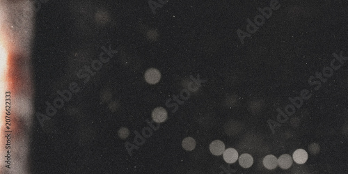 Фотография Bokeh circles with light leak grainy photo with blurred circular highlights sphe