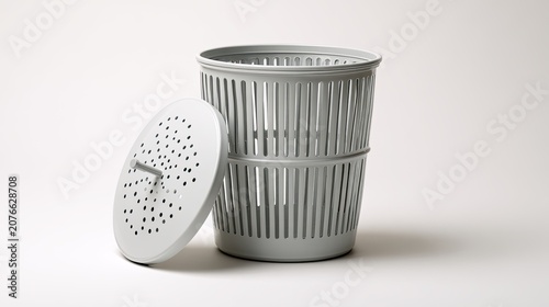 Modern Gray Plastic Trash Can with Perforated Lid and Body.