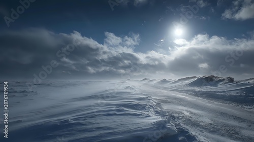 Snowstorm dramatic weather concept wind shaped snowdrifts cloudy sky atmospheric winter storytelling balanced exposure