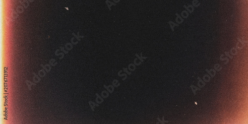 Konstfotografi Film frame with light leaks and grain dark background with reddish orange edges
