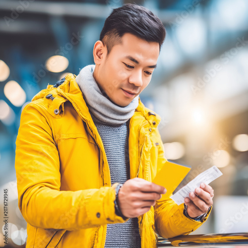 Man Checking Receipt, Personal Finance and Expense Management Concept