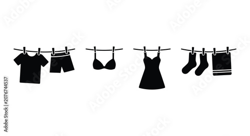 Bild auf Leinwand Clothing items hanging on a line depicted as a black silhouette apparel attire b