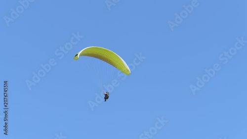 Paragliding on the background of blue sky. Live a healthy life. Be H3althy