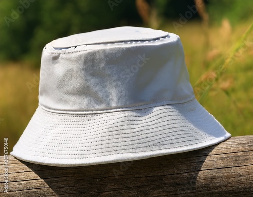 relaxing outdoor atmosphere featuring a plain white bucket hat on display