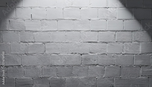 rough gray cinderblock wall painted backdrop illuminated by high key lighting copy space