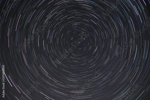 Photos Long Exposure Astrophotography of Circular Star Trails in the Night Sky