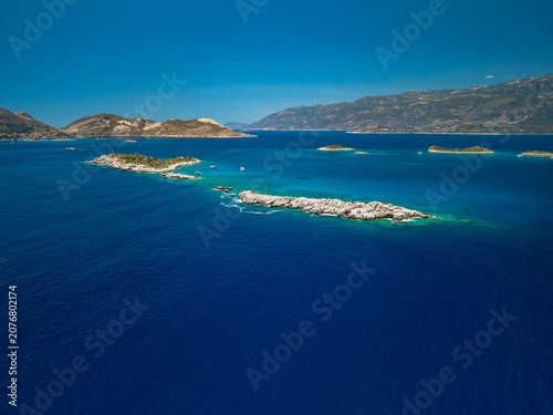 Wide aerial view of rocky islands and coastline in Kas Antalya.