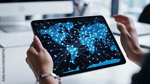 Person using world map interface on digital tablet
