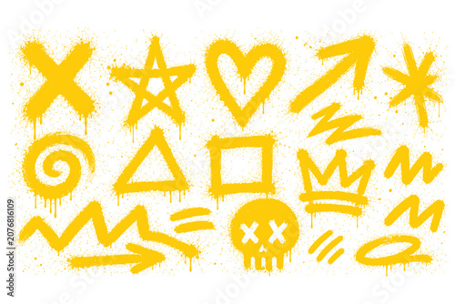 Fotografie Yellow spray paint graffiti shapes and symbols collection with graffiti splatter