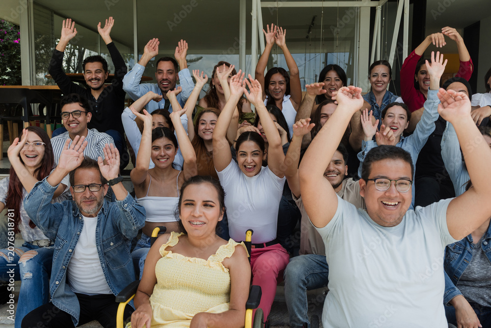 Fototapeta premium Diverse group of latin people applauding after successful conference in convention center in Mexico in Latin America, hispanic friends clapping in social meeting