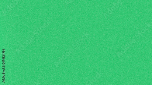 Photos Bright green abstract background with heavy grainy film noise texture across the