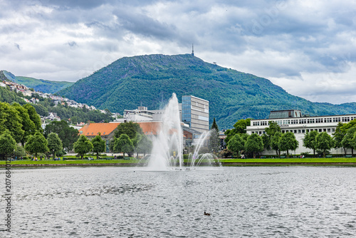 Fountain sprays water in a calm lake