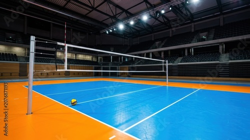 Indoor Volleyball Court with Bright Lighting and Blue Floor.