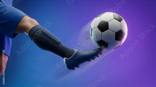 Soccer player kicking a ball with cleats on a blue purple background