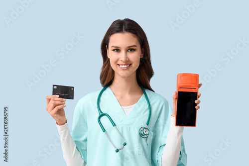 Female doctor with payment ...