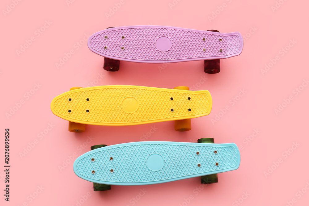 Obraz premium Colorful skateboards on pink background
