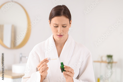 Young woman with acne probl...